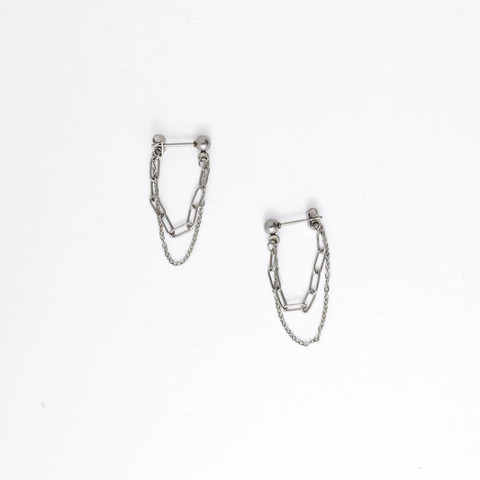 Pair of silver chain earrings on a white background