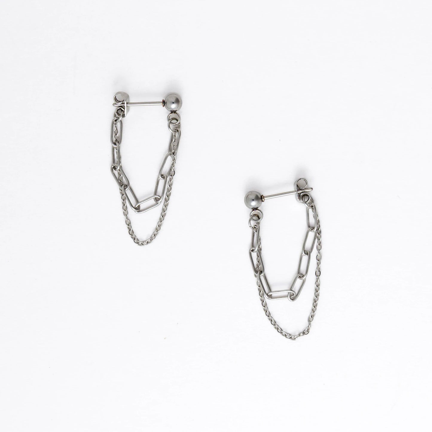 Pair of silver chain earrings on a white background