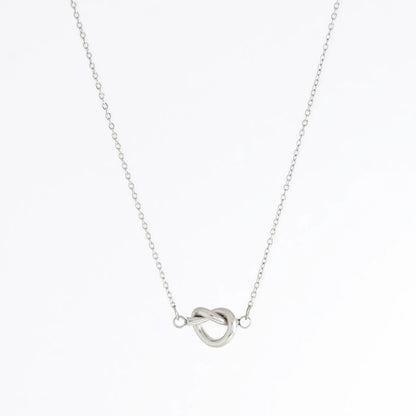 Silver necklace with a unique clasp design on a white background