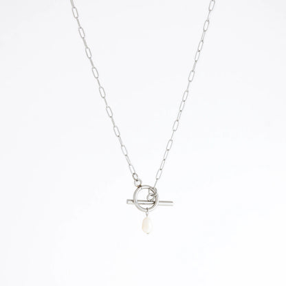 Silver necklace with a toggle clasp and pearl pendant on a white background