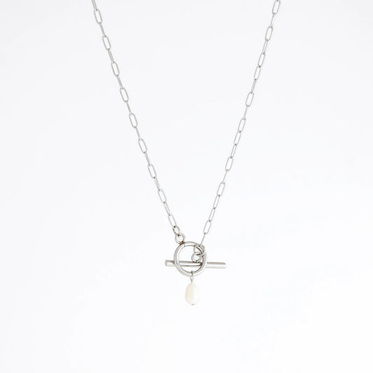 Silver necklace with a toggle clasp and pearl pendant on a white background