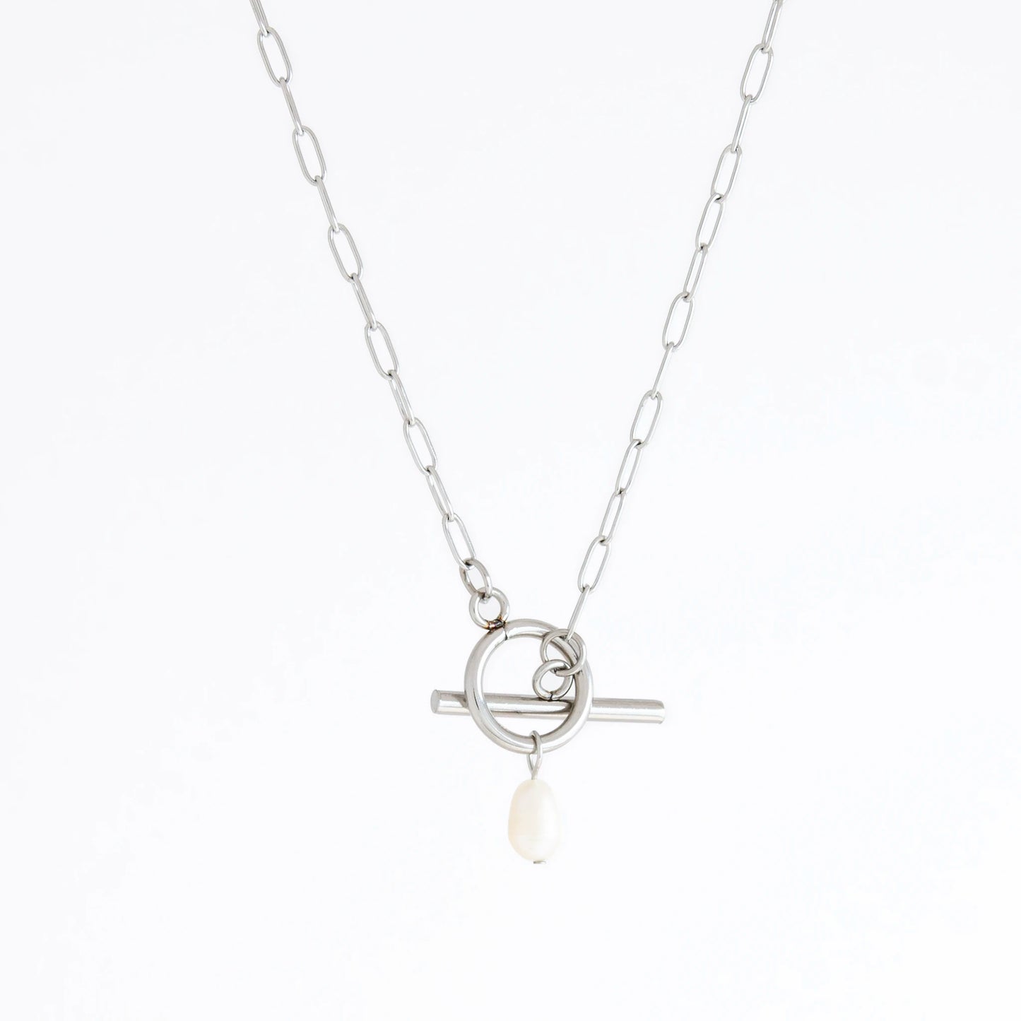 Silver necklace with a pearl pendant on a white background