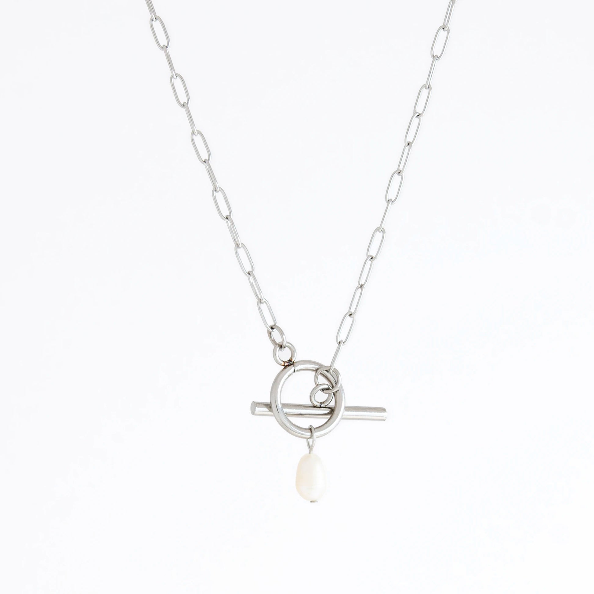 Silver necklace with a pearl pendant on a white background