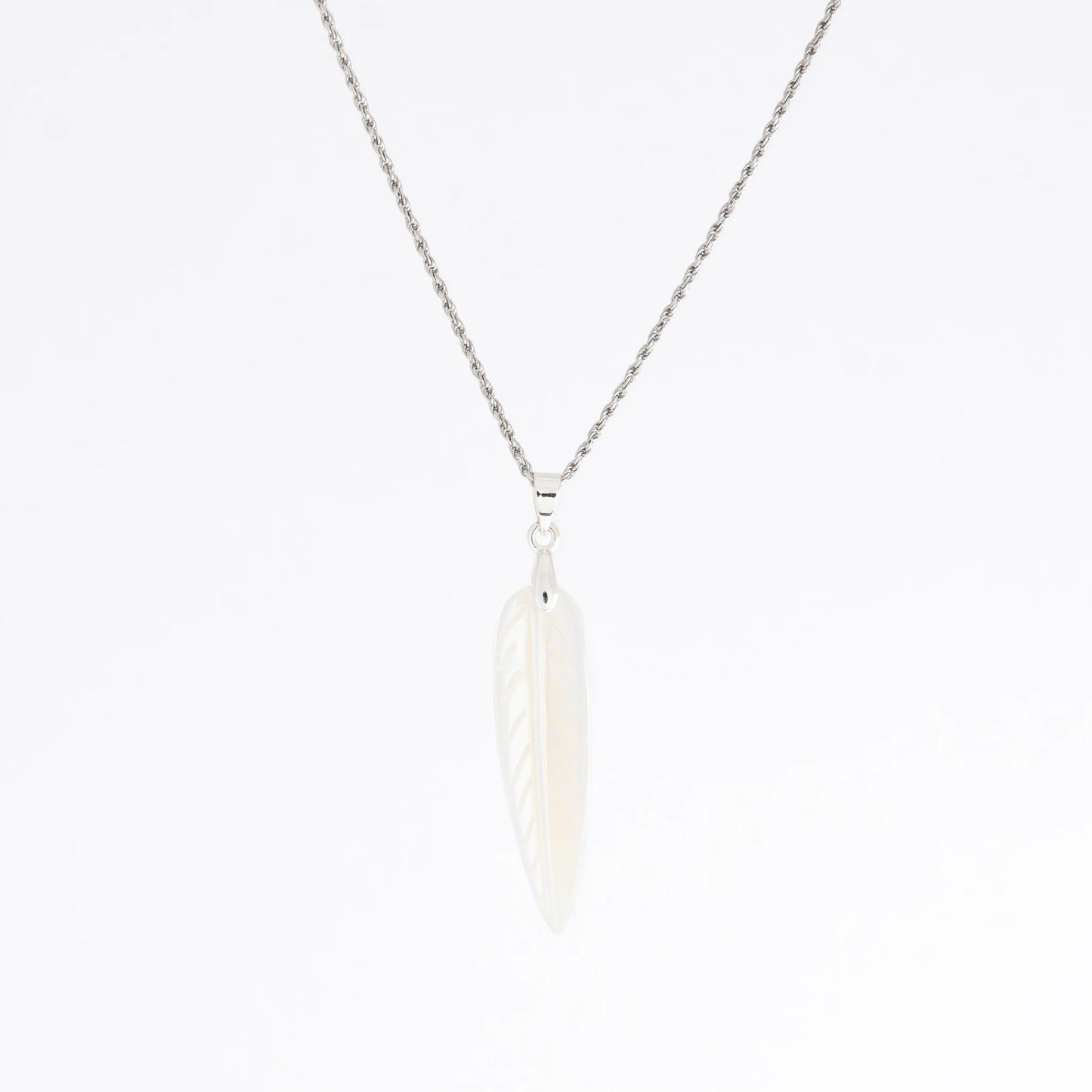 A silver chain necklace with a white feather pendant, shown against a plain white background.