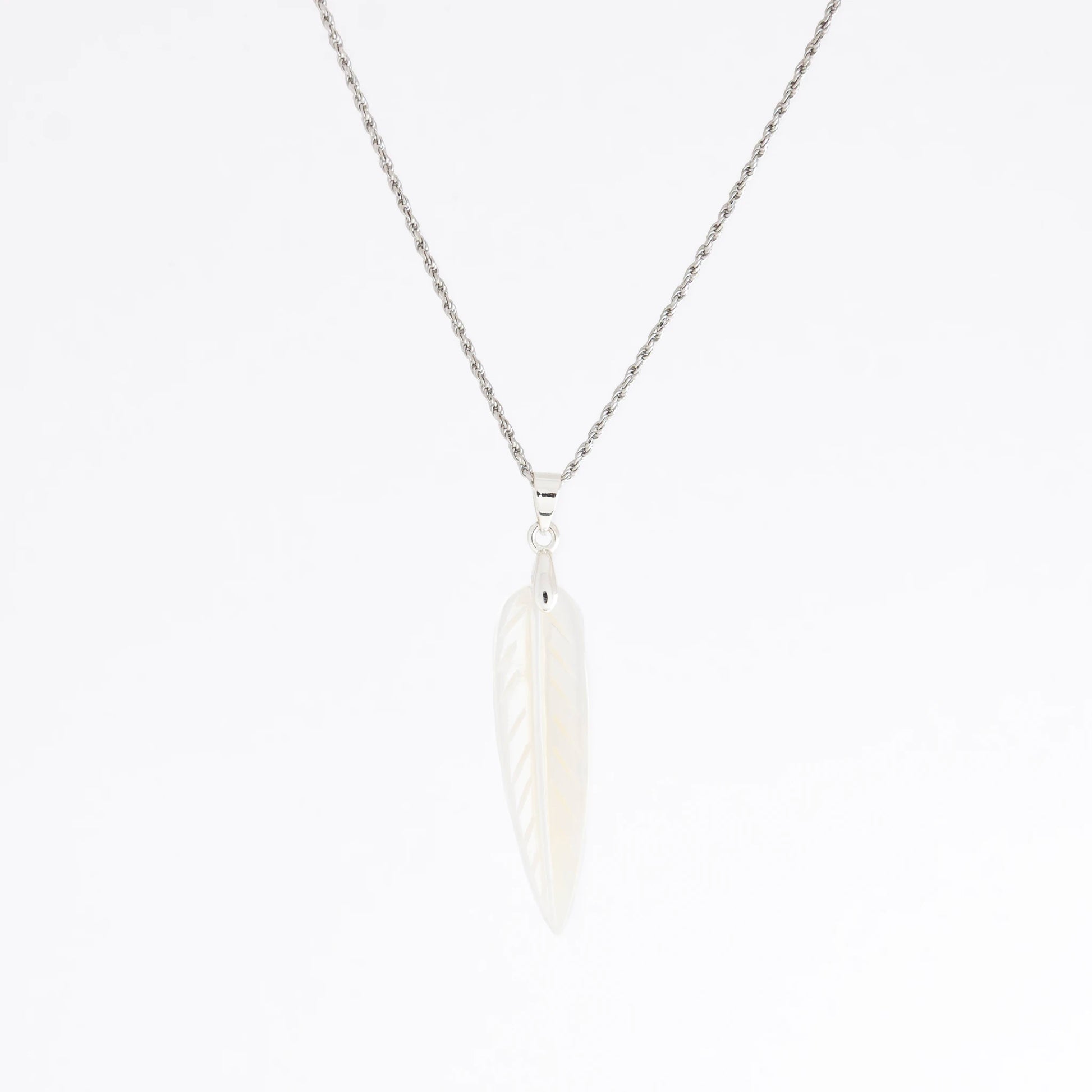 A silver chain necklace with a white feather pendant, shown against a plain white background.