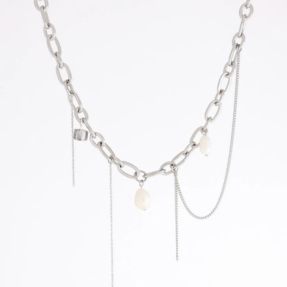 A silver-toned chain necklace featuring a chunky oval-link chain, delicate chain drapes, and three small white pearl-like beads, shown against a plain white background.