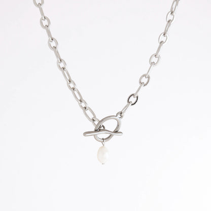 A silver chain necklace featuring a unique interlocking ring clasp with a single white pearl dangle, shown against a plain white background.