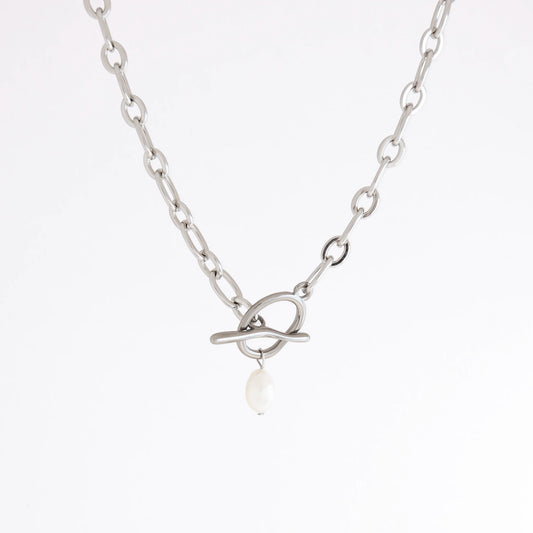 A silver chain necklace featuring a unique interlocking ring clasp with a single white pearl dangle, shown against a plain white background.