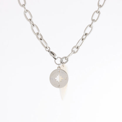A silver chain necklace featuring a circular compass pendant with a star design and engraved N, S, E, W directions, shown on a plain white background.