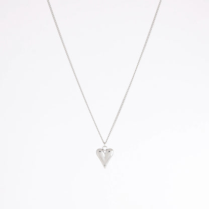 A silver chain necklace with a small, polished silver heart pendant, displayed against a clean white background.